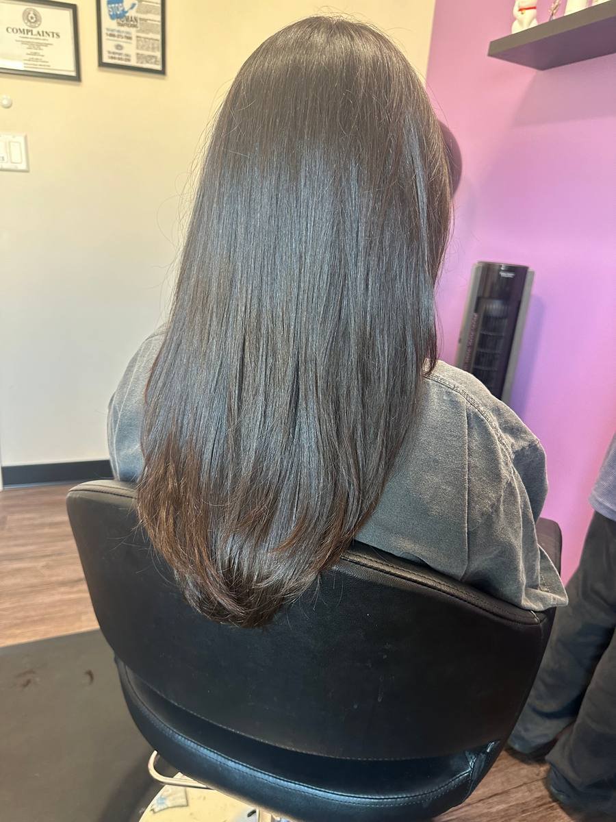 A long layered cut finished with a glossy, healthy blowout