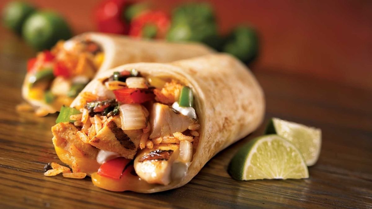 Representative photo of a grilled chicken burrito with peppers and rice