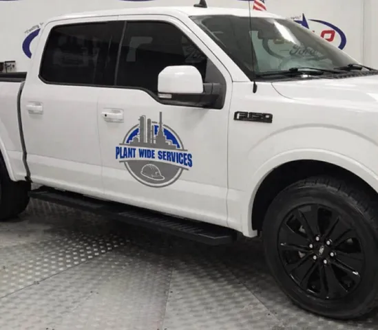 Plant Wide Services Ford F-150 service truck with company decals on the door.