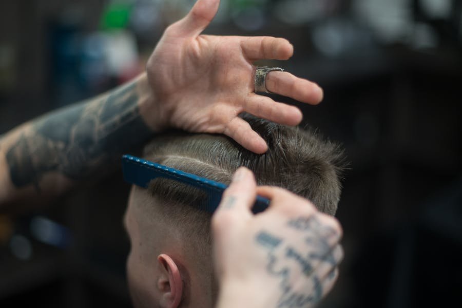 Representative photo of a skin fade being combed in
