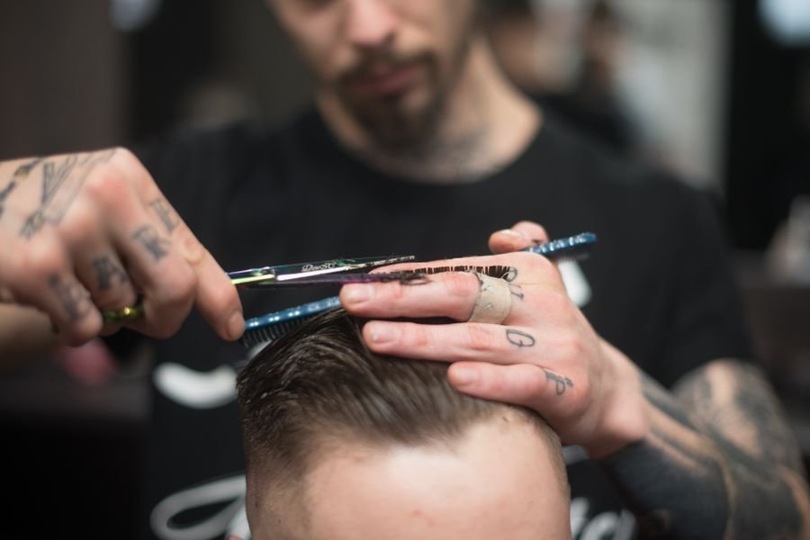 Representative photo of a men's scissor haircut in progress