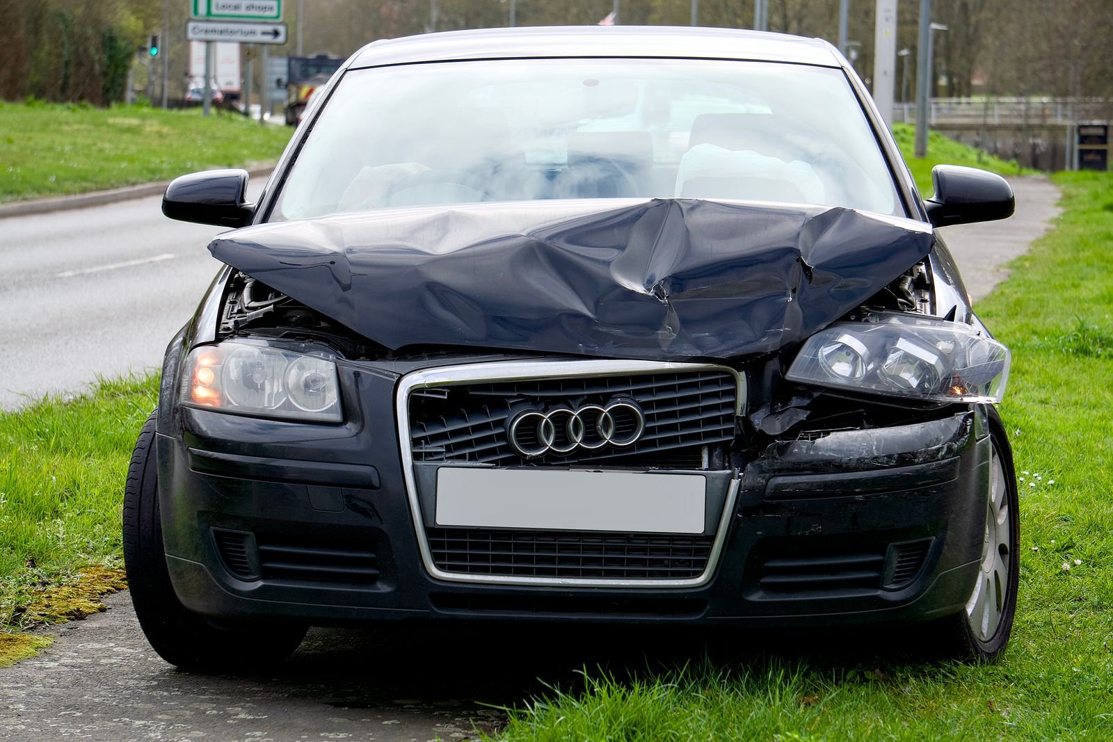 Representative photo of a car with front-end collision damage before repair